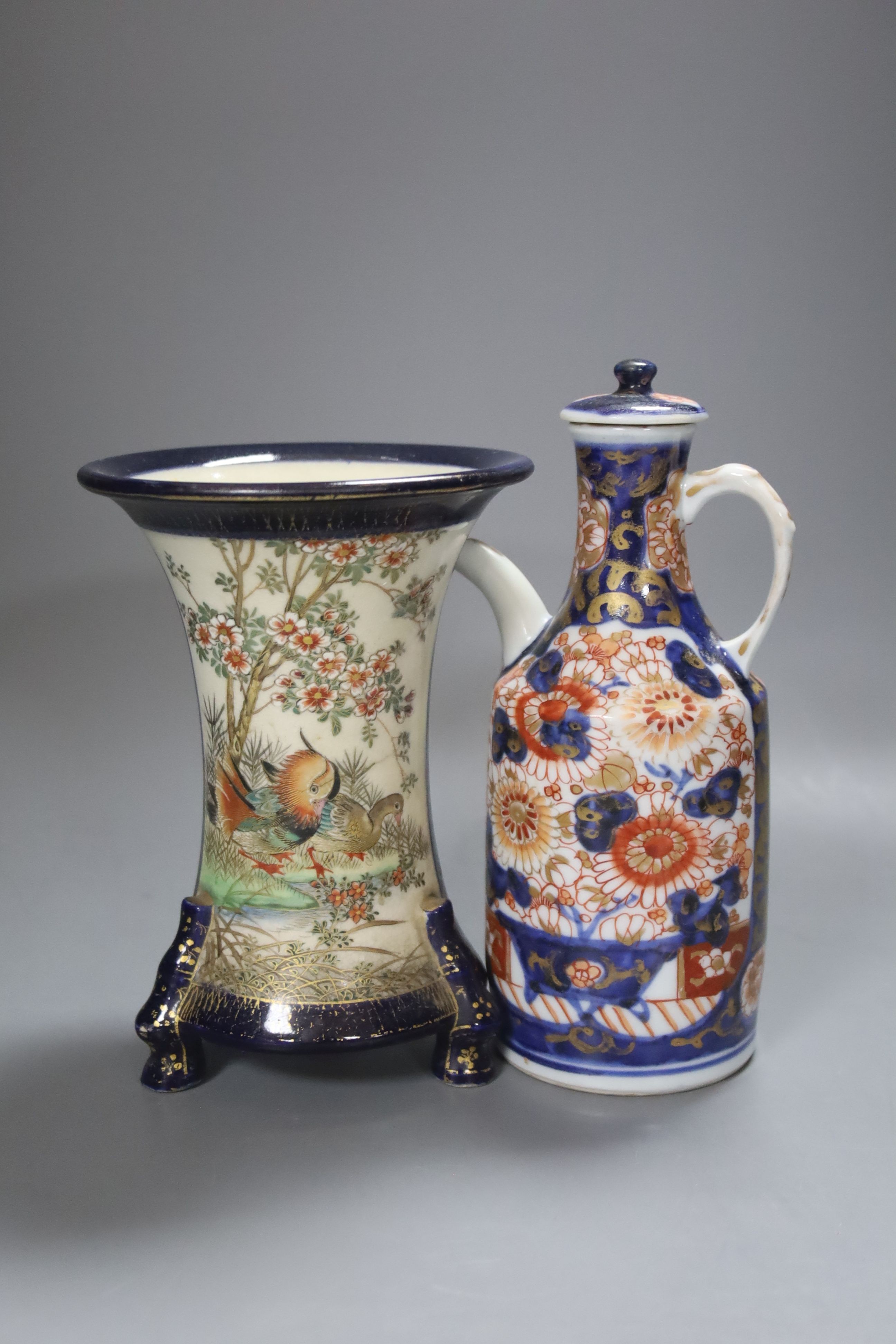 A Japanese Imari sake jug and a Satsuma pottery blue ground vase, tallest 18cm